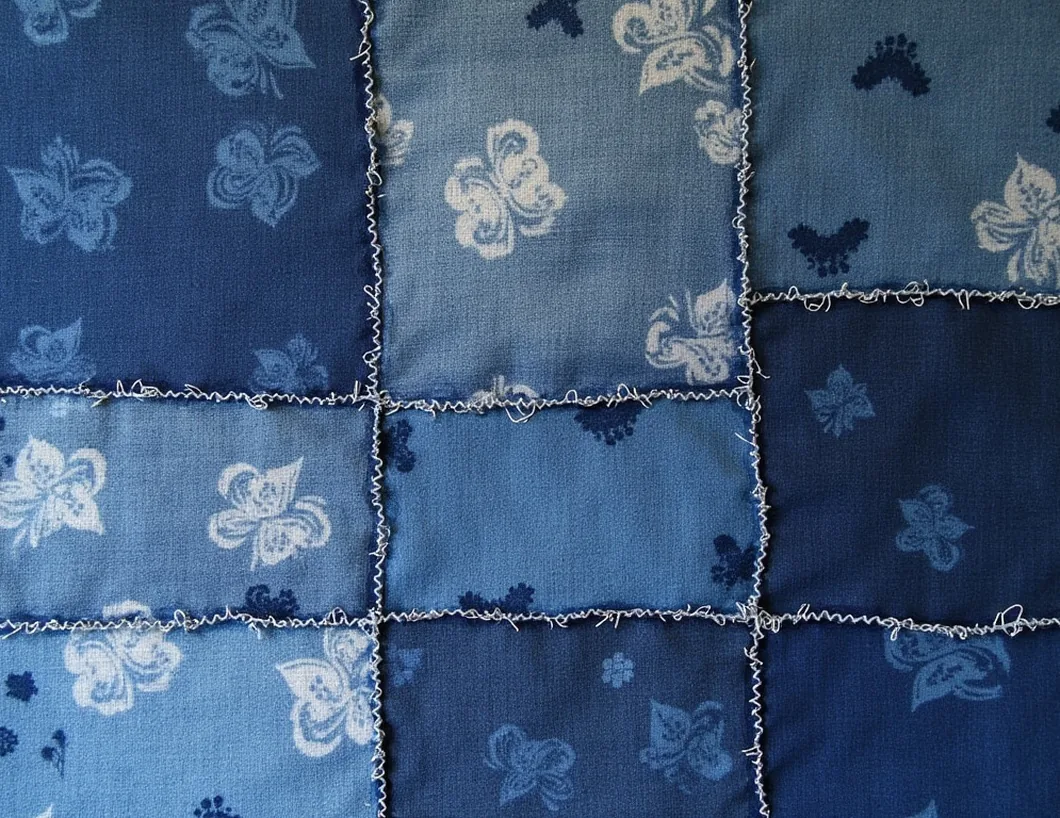 Boro textile patchwork built from recycled indigo fabrics in Japanese mending tradition